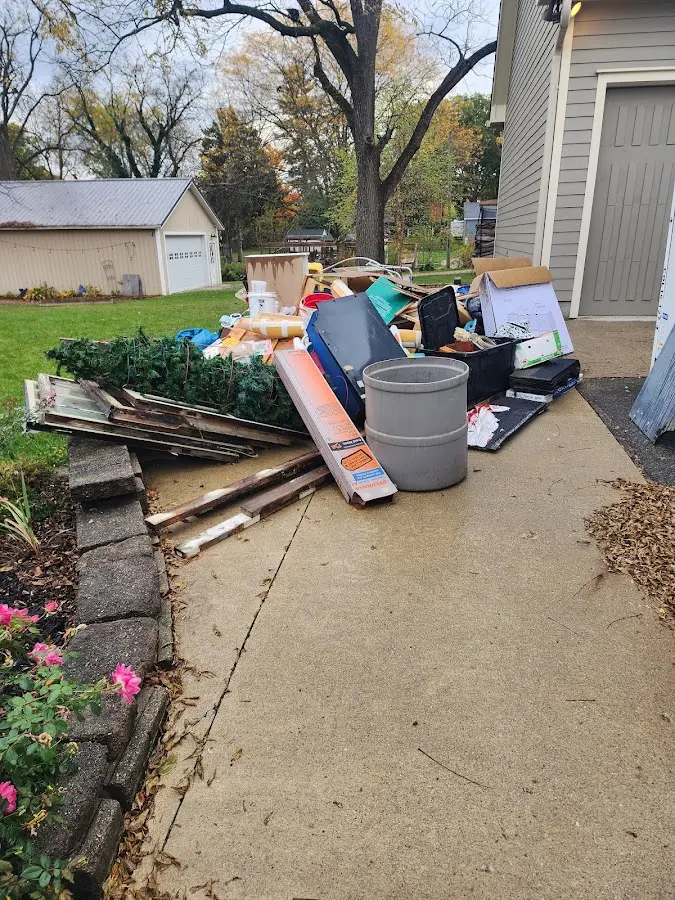 Dumpster being loaded with debris for 10 Yard Dumpster Rental in Vicksburg